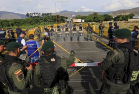 Venezuela-Colombian border partially reopens for truck passage